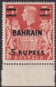 Click for more photos and details Bahrain 1949 King George VI 5r Surcharge on 5sh with T Mark in Hair Mint SG60