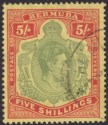 Click for more photos and details Bermuda 1946 KGVI 5sh Dull Green and Pale Red on Pale Yellow p14 Used SG118e