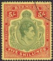 Click for more photos and details Bermuda 1941 KGVI 5sh Dull Yellow-Green + Red on Yellow p14¼ Used SG118b cat £35