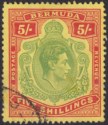 Click for more photos and details Bermuda 1950 KGVI 5sh Deep Green + Bright Red on Yellow p13 Used SG118g cat £65