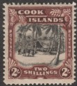 Click for more photos and details Cook Islands 1945 Village 2sh Black and Red-Brown wmk Multi Mint SG144
