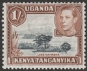 Click for more photos and details Kenya Uganda Tanganyika 1938 KGVI 1sh Black + Yellowish Brown p13x11¾ Mint SG145