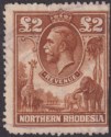 Click for more photos and details Northern Rhodesia 1925 KGV Revenue £2 Brown Used BF1 - FAULTY
