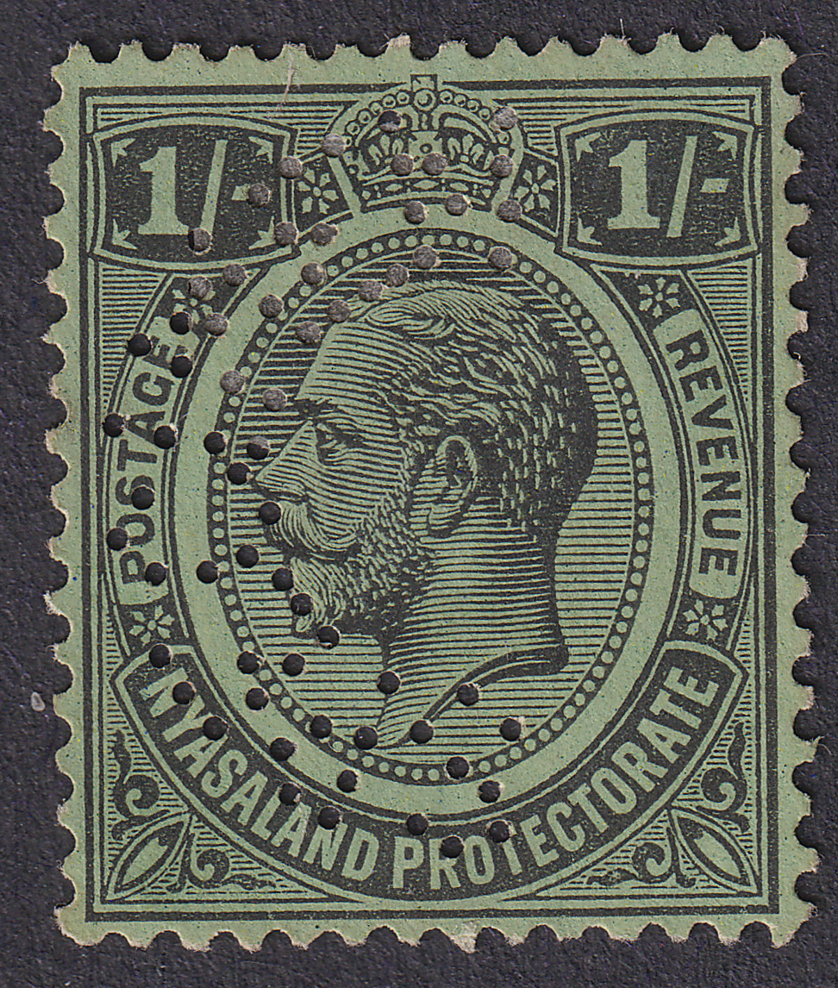 Nyasaland 1930 KGV SPECIMEN Perf 1sh Black on Emerald Unused SG108s