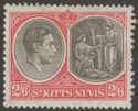 Click for more photos and details St Kitts-Nevis 1938 KGVI 2sh6d Black and Scarlet p13x12 Ordinary Mint SG76