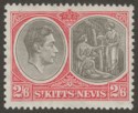 Click for more photos and details St Kitts-Nevis 1938 KGVI 2sh6d Black and Scarlet p13x12 Ordinary Mint SG76